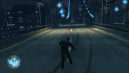 Player character Niko Bellic walks down a road while intoxicated, followed by driving in a car while intoxicated. In both scenes, the gameplay vision is shaky and blurred.