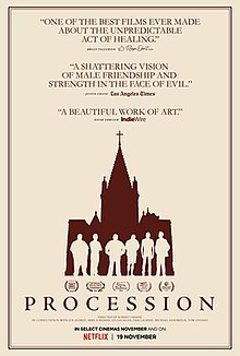 The silhouettes of six people standing in front of a church.