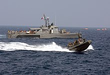 US Navy 090906-N-0120R-068 A Philippine Navy patrol boat and an 11-meter rigid hull inflatable boat operated by members of Joint Special Operations Task Force-Philippines (JSOTF-P) search for survivors Sept. 6, 2009.jpg