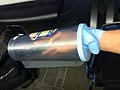 Hand stuck through glove tears the glove, distorts if large hand